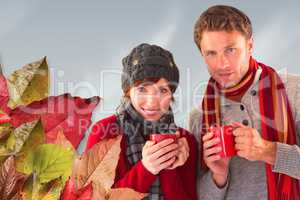 Composite image of couple both having warm drinks