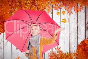 Composite image of woman checking to see if its raining