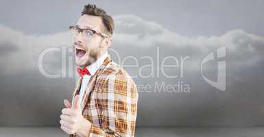 Composite image of geeky hipster pointing at camera