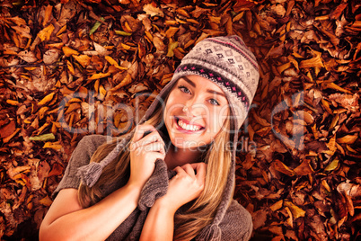 Composite image of happy blonde in winter clothes posing