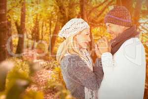 Composite image of cute smiling couple holding hands