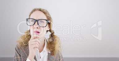 Composite image of geeky hipster woman thinking with hand on chi
