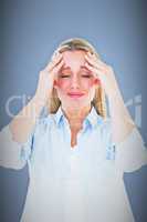 Composite image of portrait of a blonde getting a headache