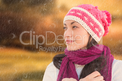 Composite image of pretty brunette in winter clothes