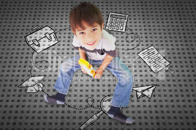 Composite image of cute boy sitting with building blocks