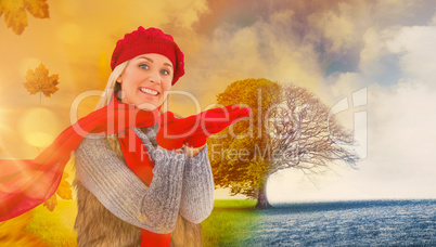 Composite image of blonde in winter clothes with hands out