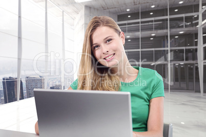 Composite image of student on laptop