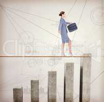 Composite image of businesswoman walking tightrope