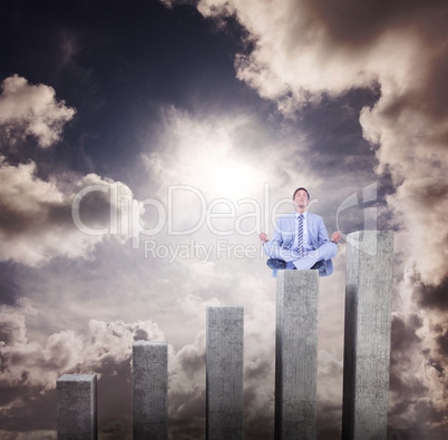 Composite image of calm businessman meditating in lotus pose