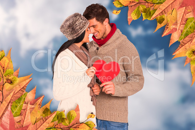 Composite image of young couple smiling and hugging