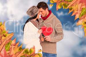 Composite image of young couple smiling and hugging