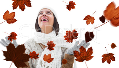 Composite image of brunette in warm clothing