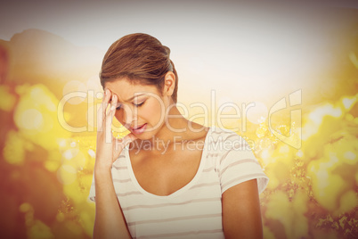 Composite image of upset woman suffering from headache