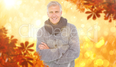 Composite image of casual man in warm clothing