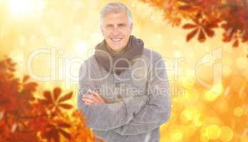 Composite image of casual man in warm clothing