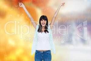 Composite image of excited woman with hands raised on white back