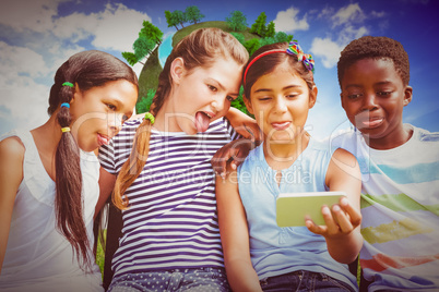 Composite image of happy children taking selfie at park