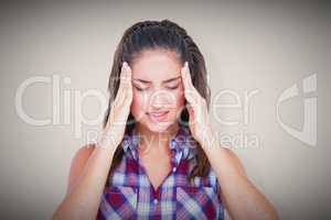 Composite image of upset woman suffering from headache