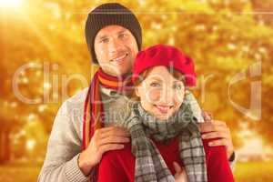 Composite image of couple smiling at the camera