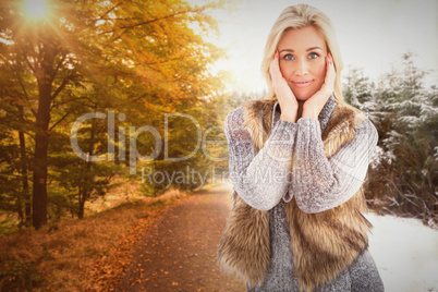 Composite image of blonde in winter clothes smiling at camera