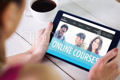 Composite image of woman using tablet pc