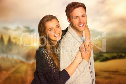 Composite image of portrait of happy young couple