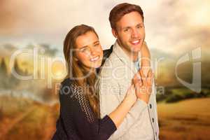 Composite image of portrait of happy young couple