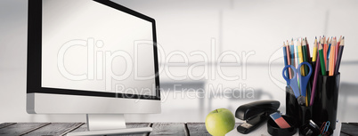 Composite image of school supplies on desk