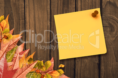Composite image of yellow pinned adhesive note