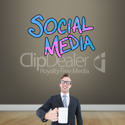 Composite image of happy geeky businessman holding coffee mug