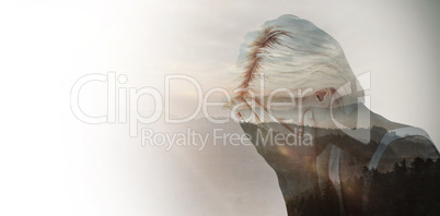 Composite image of sad blonde woman crying with head on hands