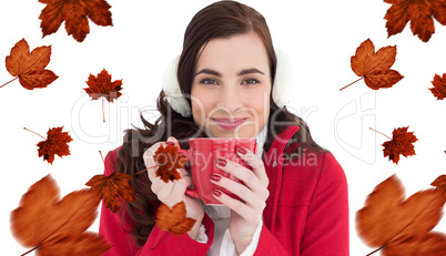 Composite image of woman in winter clothes enjoying a hot drink