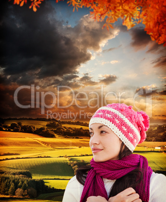 Composite image of pretty brunette in winter clothes