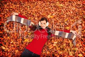 Composite image of cheerful brunette holding scarf and spread he