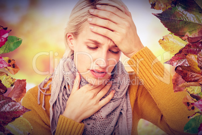 Composite image of woman feeling her forehead for a temperature