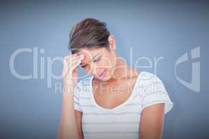 Composite image of beautiful woman suffering from headache