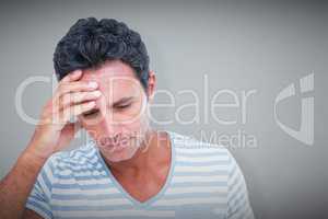 Composite image of upset man with hand on forehead