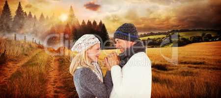 Composite image of cute smiling couple holding hands