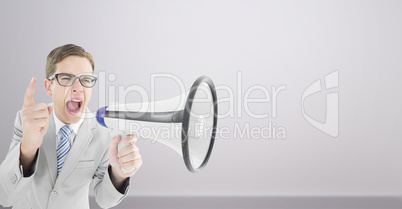 Composite image of geeky businessman shouting through megaphone