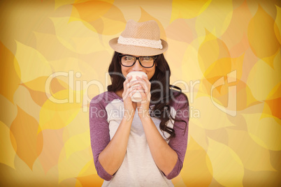 Composite image of brunette with disposable cup