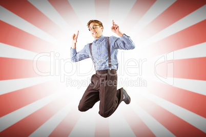 Composite image of geeky hipster jumping and pointing