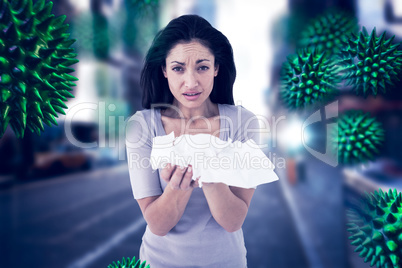 Composite image of sick brunette looking at camera