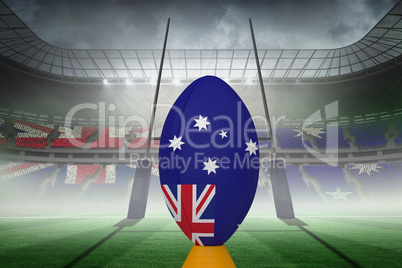 Composite image of australian flag rugby ball on stand