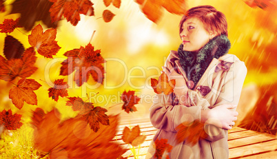 Composite image of thoughtful woman in winter coat