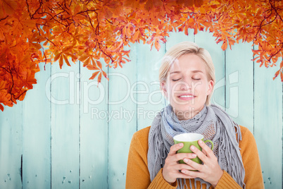 Composite image of close up of woman drinking from a cup