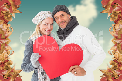 Composite image of portrait of happy couple holding heart