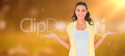 Composite image of pretty brunette presenting with hands