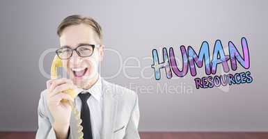 Composite image of geeky businessman talking on retro phone