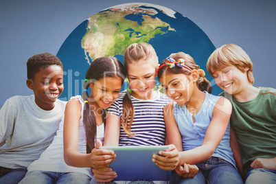 Composite image of children using digital tablet at park