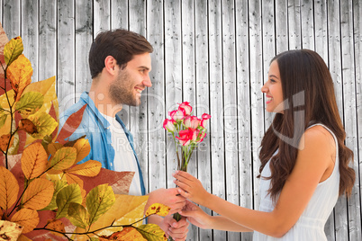 Composite image of happy hipster giving his girlfriend roses